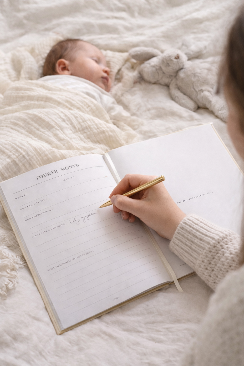 Linen Baby Memory Book, Open showing first year milestone pages