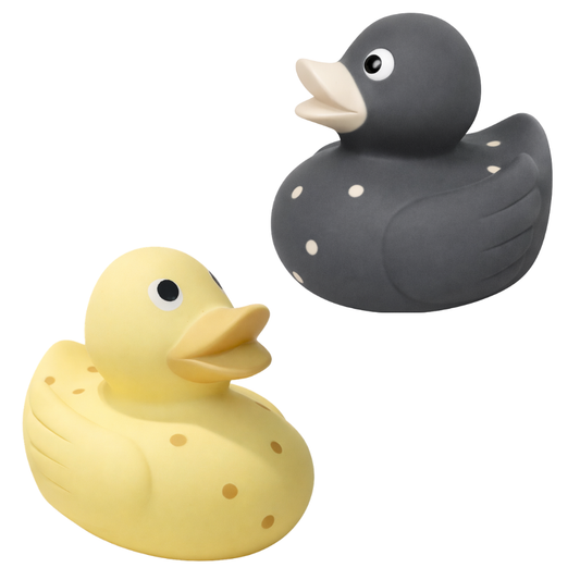 Two natural rubber bath ducks, one yellow and one grey with beige spots , Kai and SIsi. No Holes. Natural Toys for children. Mama and Bubba